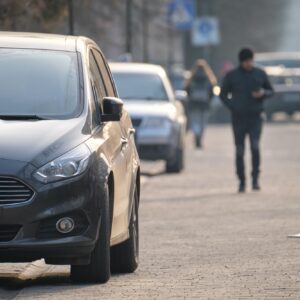 Close up of a car parked illegally against traffic rules on pedestrian city street side