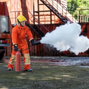 Fireman wearing fire protection suite and oxygen tank exercise hold extinguisher tank and pray